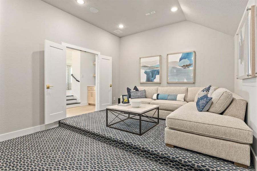 Living area featuring baseboards and recessed lighting Living area featuring baseboards and recessed lighting