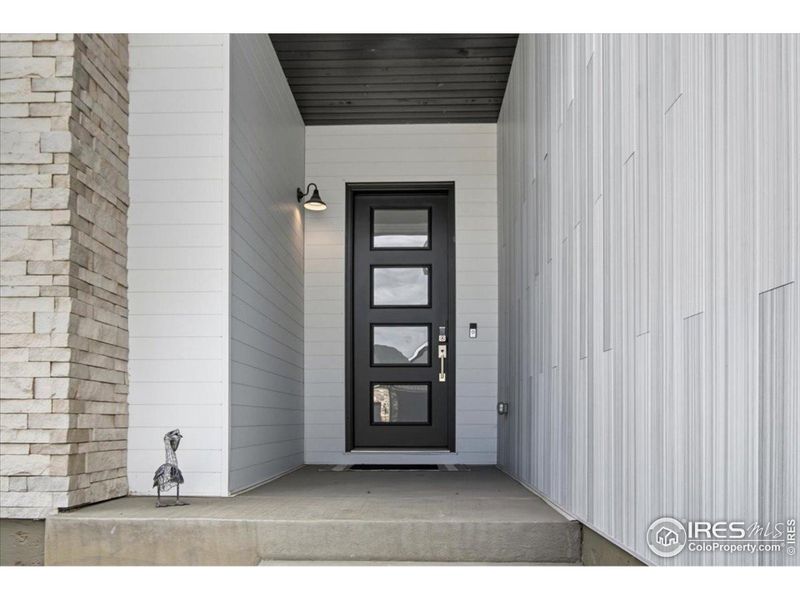 Exterior details and patio area of a home in Pelican Shores at Water Valley, Windsor (Image 4).