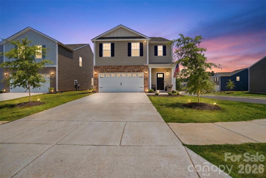 Front exterior of a new home in Fergus Crossing, York, SC, highlighting curb appeal (Image 24). Front exterior of a new home in Fergus Crossing, York, SC, highlighting curb appeal (Image 24).