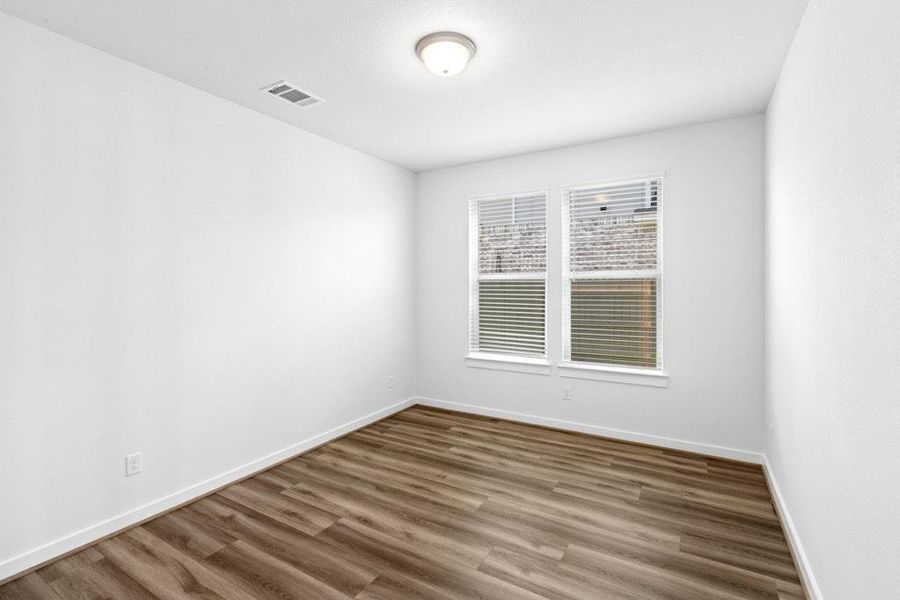 Spacious, unfurnished interior of a new home in The Colony, Bastrop (Image 13).