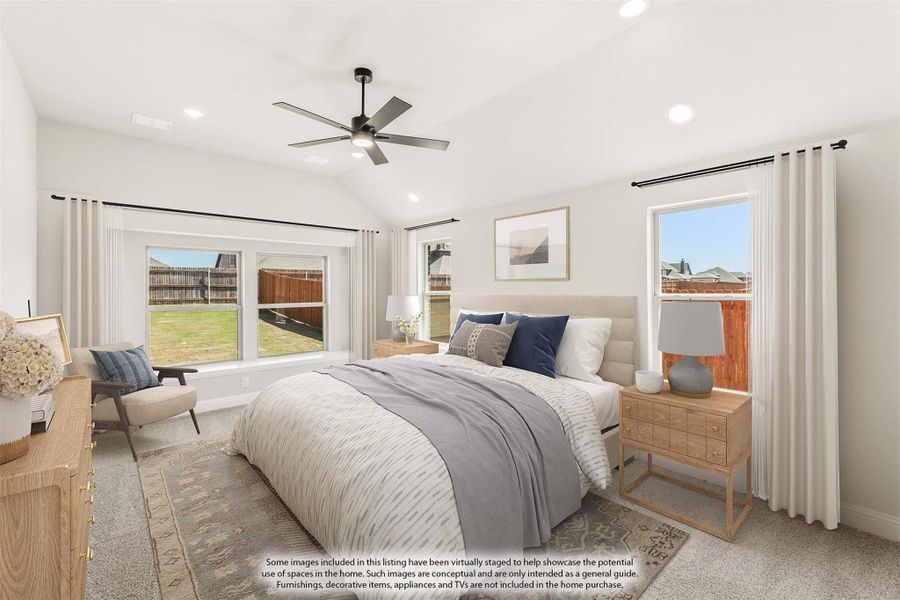 Spacious master bedroom with vaulted ceiling, ceiling fan, carpet flooring, and multiple windows with backyard views Spacious master bedroom with vaulted ceiling, ceiling fan, carpet flooring, and multiple windows with backyard views