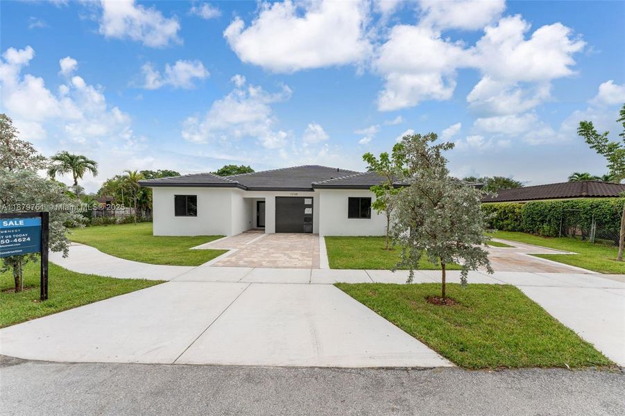 Front exterior of a new home in , Miami, FL, highlighting curb appeal (Image 26). Front exterior of a new home in , Miami, FL, highlighting curb appeal (Image 26).