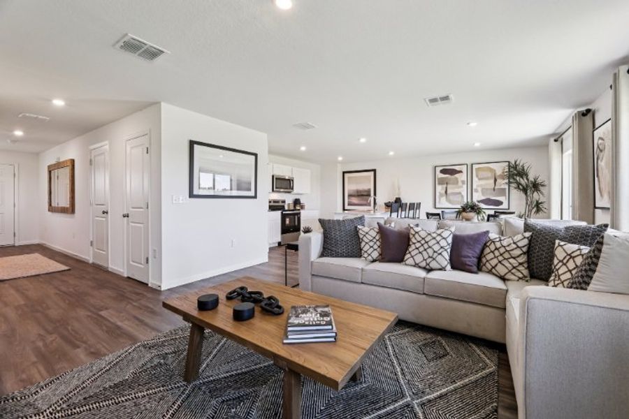 A living room with a couch and coffee table. A living room with a couch and coffee table.