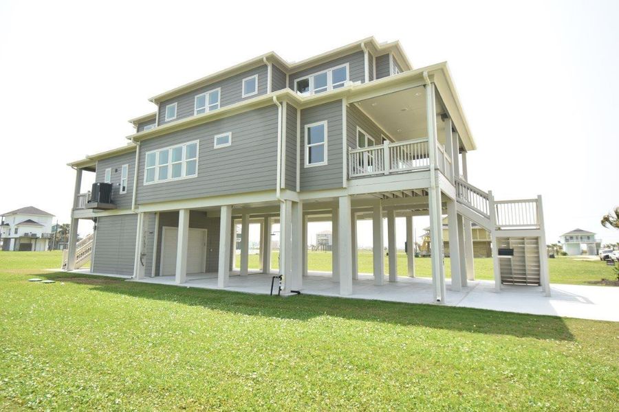Front exterior of a new home in , Galveston, TX, highlighting curb appeal (Image 24). Front exterior of a new home in , Galveston, TX, highlighting curb appeal (Image 24).