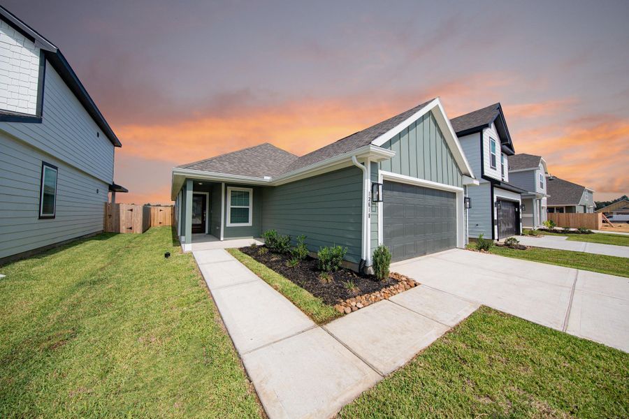 Front exterior of a new home in Townsend Reserve, Splendora, TX, highlighting curb appeal (Image 2).