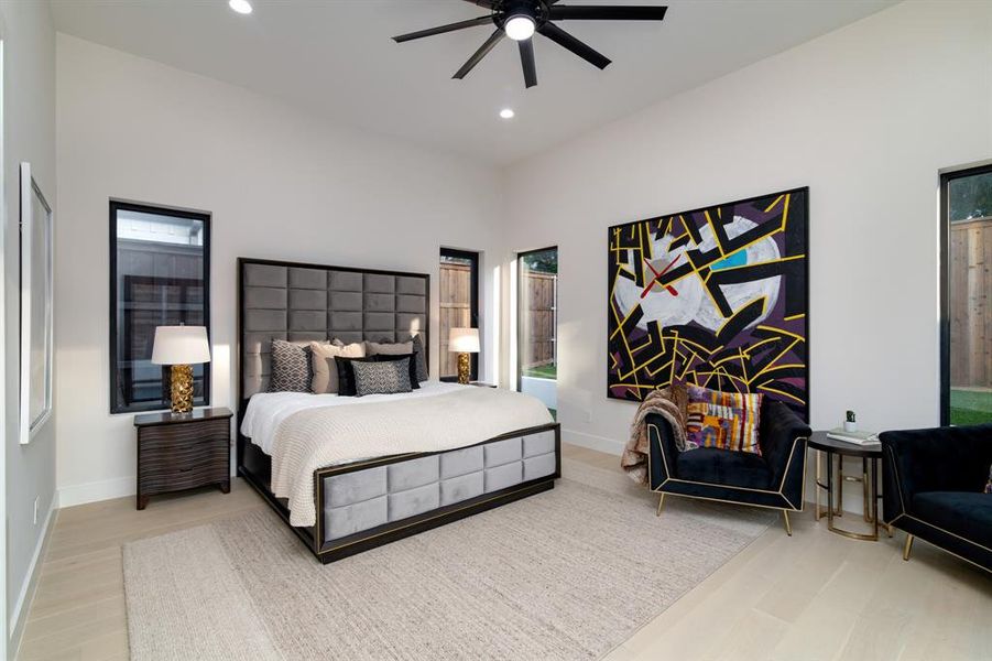 Bedroom with ceiling fan and light hardwood / wood-style flooring