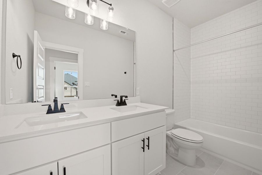 Furnished interior view inside a new home in Heritage, Dripping Springs (Image 14).