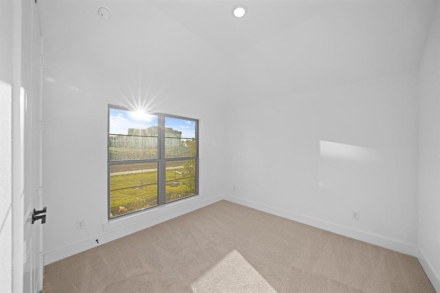 Spare room featuring carpet floors and recessed lighting Spare room featuring carpet floors and recessed lighting