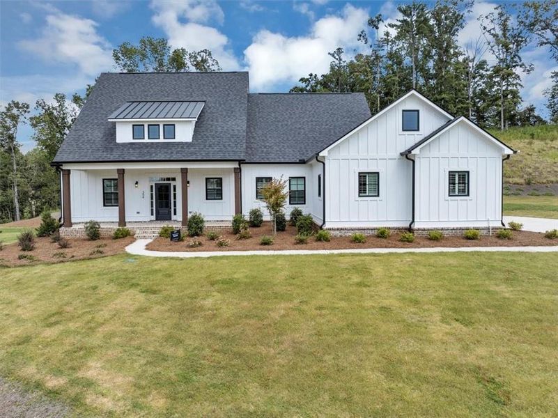 Front exterior of a new home in , Ball Ground, GA, highlighting curb appeal (Image 23).