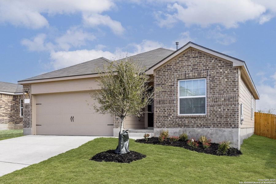 Front exterior of a new home in Preserve at Medina, Von Ormy, TX, highlighting curb appeal (Image 14).