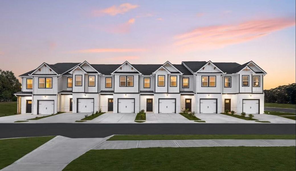 Front exterior of a new home in The Grove At Mundy Mill, Gainesville, GA, highlighting curb appeal (Image 13).
