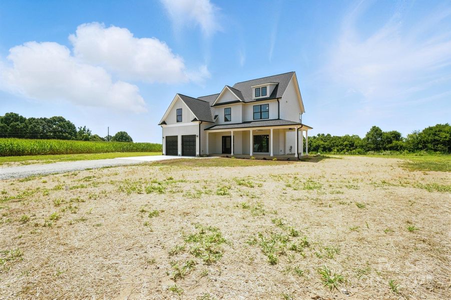 Front exterior of a new home in , Marshville, NC, highlighting curb appeal (Image 17).