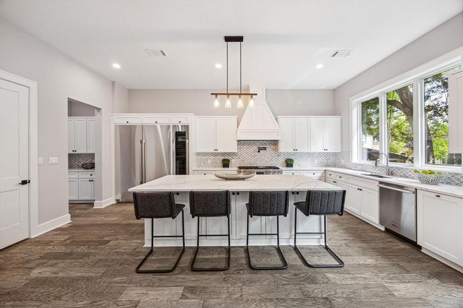 A generous island with ample storage in the custom cabinetry