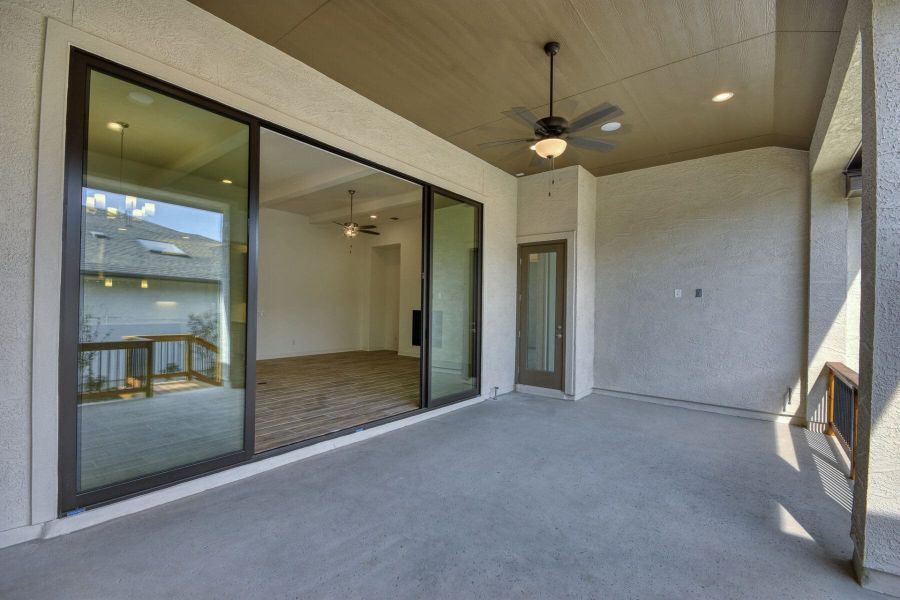 Exterior details and patio area of a home in El Sonido at Campanas, San Antonio (Image 24).