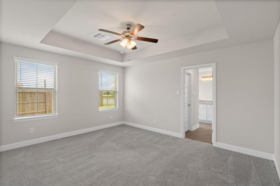 Spacious, unfurnished interior of a new home in Sunterra, Katy (Image 30).