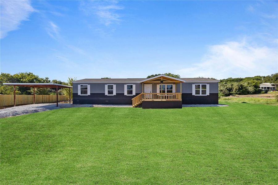 View of front of property with a front lawn