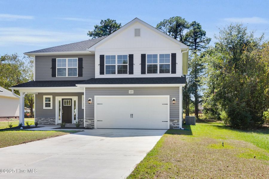 Front exterior of a new home in Fairfield Harbour, New Bern, NC, highlighting curb appeal (Image 2).