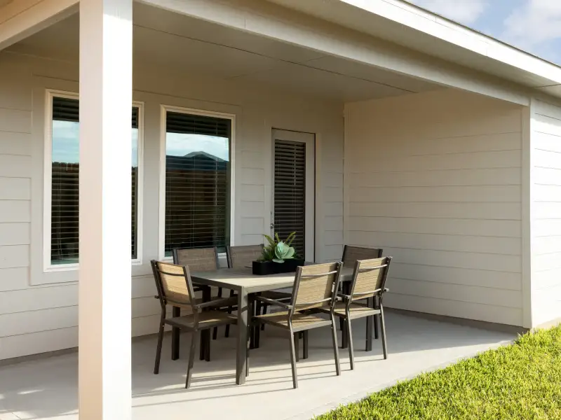 Exterior details and patio area of a home in Riviera Pines - Traditional Series, Huffman (Image 2). Exterior details and patio area of a home in Riviera Pines - Traditional Series, Huffman (Image 2).