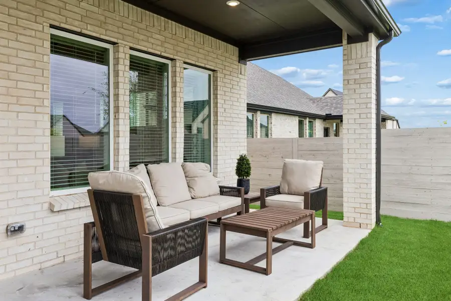 Exterior details and patio area of a home in Painted Tree Woodland West, McKinney (Image 3). Exterior details and patio area of a home in Painted Tree Woodland West, McKinney (Image 3).