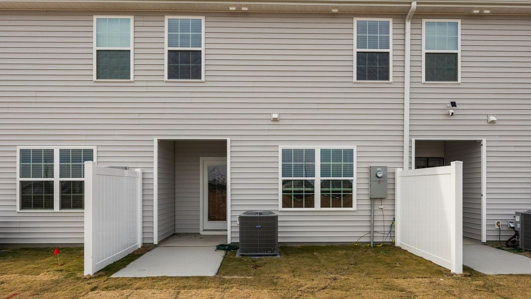 Exterior details and patio area of a home in The Townes at Ridgewood Farms, Winterville (Image 19). Exterior details and patio area of a home in The Townes at Ridgewood Farms, Winterville (Image 19).
