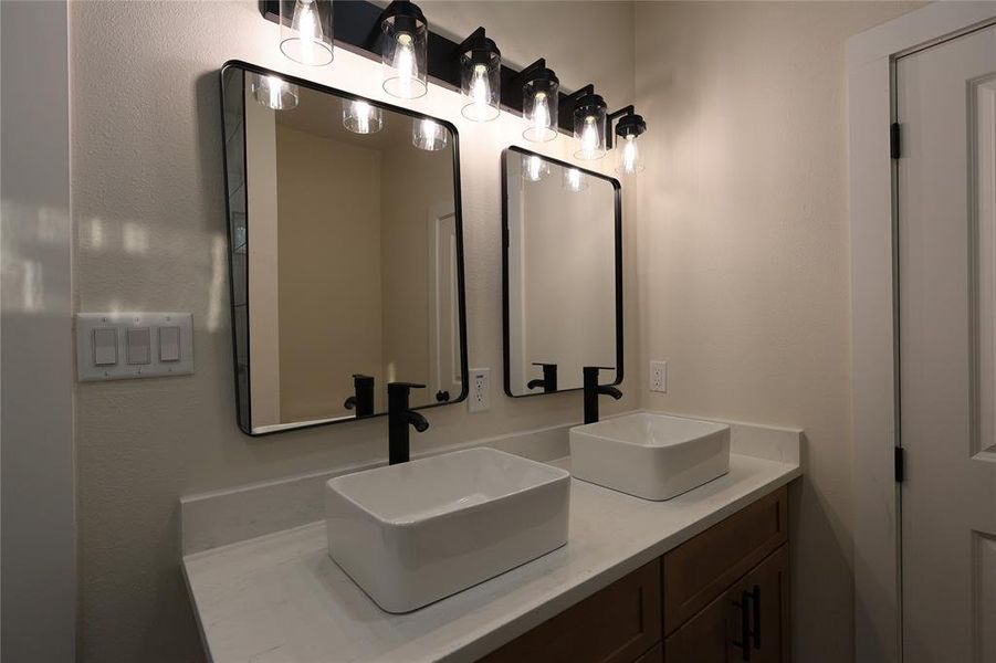 Full bathroom featuring double vanity