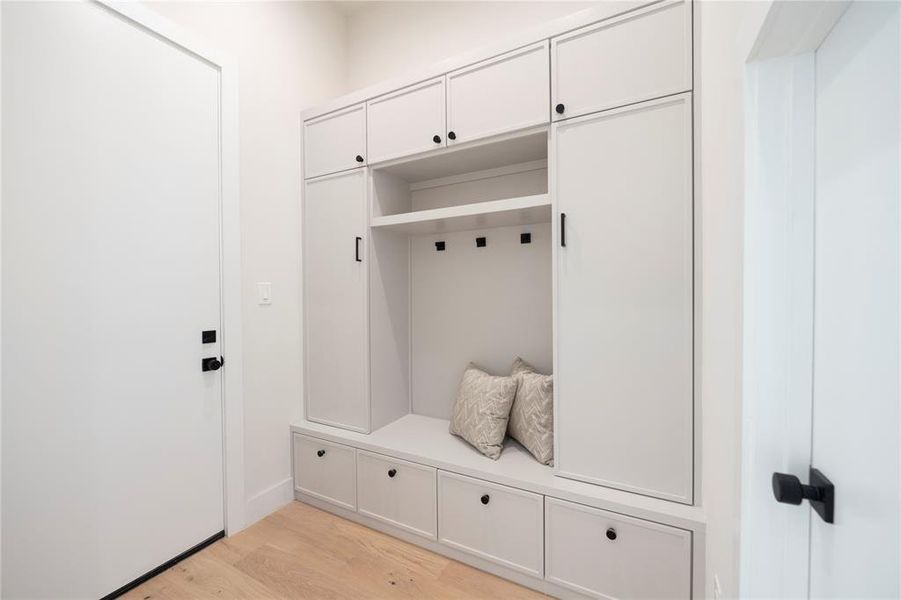 Mudroom featuring light wood-type flooring