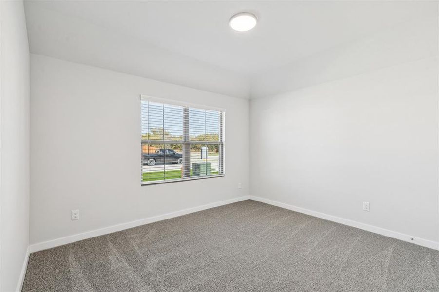 Bedroom in the Oscar home plan by Trophy Signature Homes – REPRESENTATIVE PHOTO