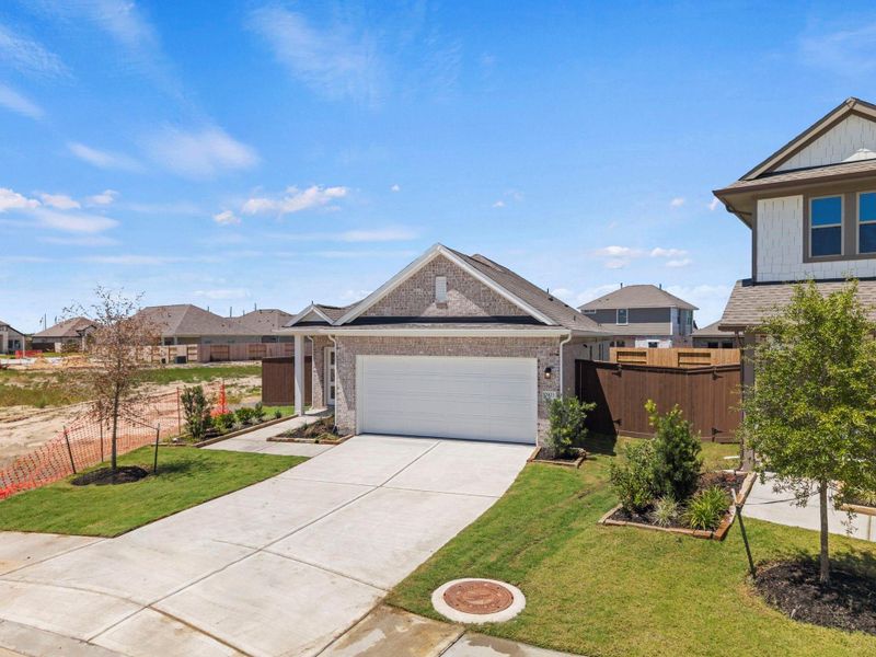 Front exterior of a new home in Creekhaven, Rosharon, TX, highlighting curb appeal (Image 20).