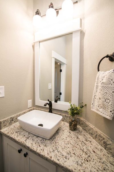 Representative furnished interior of a home built from the The Ashley by Reece Homes in Oakmont, Bryan (Image 22).