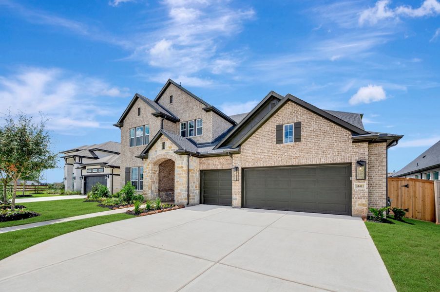 Front exterior of a new home in Jordan Ranch - Premier Collection, Fulshear, TX, highlighting curb appeal (Image 23).