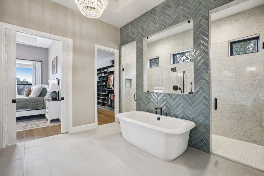 Spa-Inspired Bath: The en-suite bath is a masterpiece, featuring a freestanding garden tub and a walk-in glass shower.