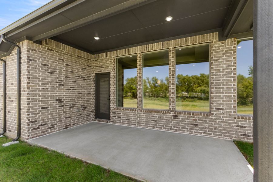 Exterior details and patio area of a home in Mockingbird Hills - Premiere Series, Joshua (Image 3). Exterior details and patio area of a home in Mockingbird Hills - Premiere Series, Joshua (Image 3).
