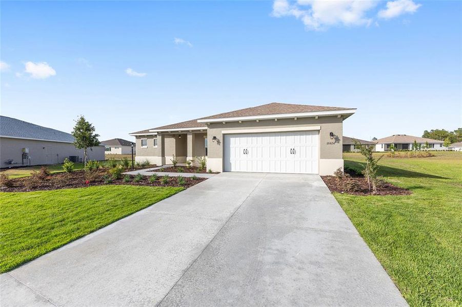 Front exterior of a new home in , Ocala, FL, highlighting curb appeal (Image 19).