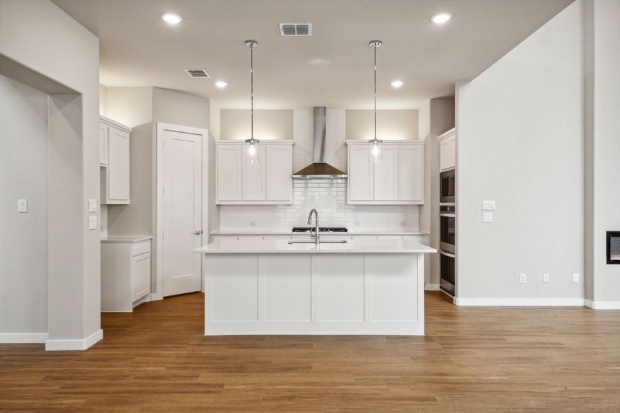 Kitchen in the Da Vinci II home plan by Trophy Signature Homes – REPRESENTATIVE PHOTO