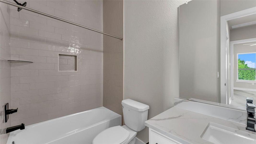 Full bath with vanity, tub / shower combination, and a textured wall