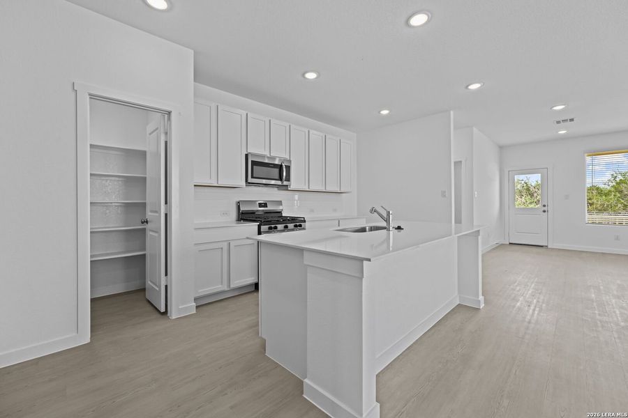Furnished interior view inside a new home in Waterwheel, San Antonio (Image 8).