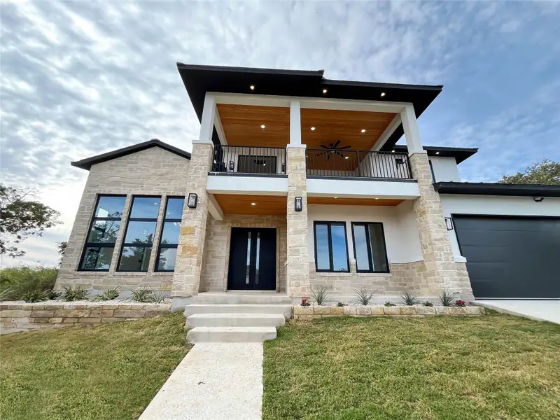 Front exterior of a new home in , Horseshoe Bay, TX, highlighting curb appeal (Image 1). Front exterior of a new home in , Horseshoe Bay, TX, highlighting curb appeal (Image 1).