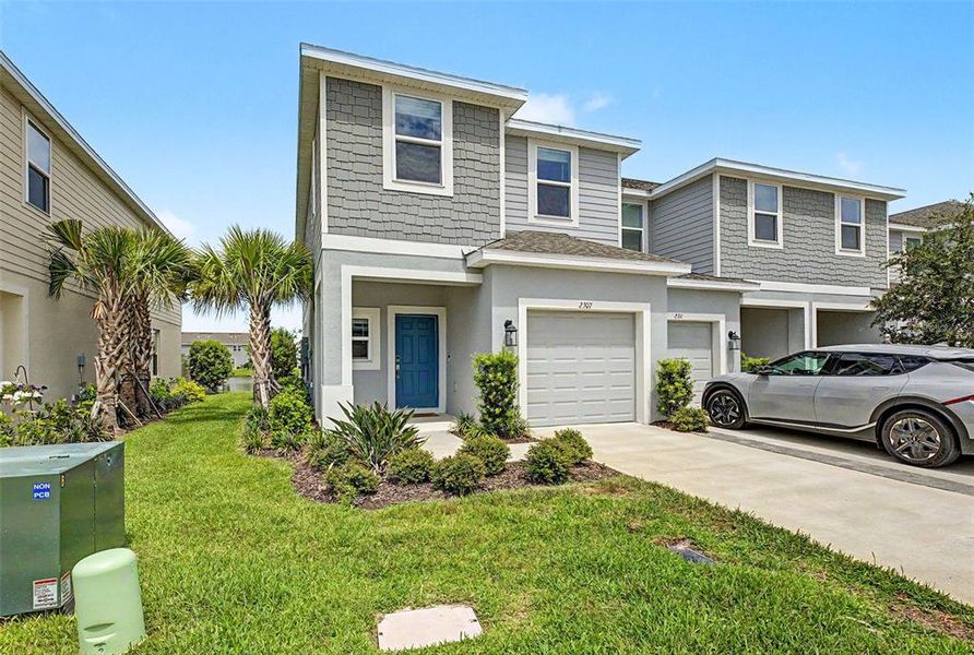 Front exterior of a new home in , Wesley Chapel, FL, highlighting curb appeal (Image 25). Front exterior of a new home in , Wesley Chapel, FL, highlighting curb appeal (Image 25).