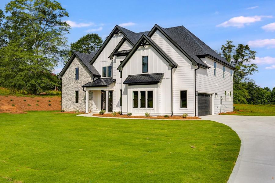 Front exterior of a new home in Harmon Springs, Carrollton, GA, highlighting curb appeal (Image 25).