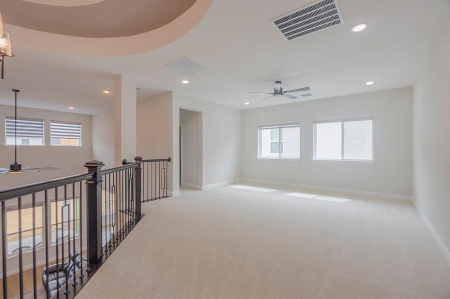 Unfurnished room with visible vents, baseboards, ceiling fan, light colored carpet, and recessed lighting