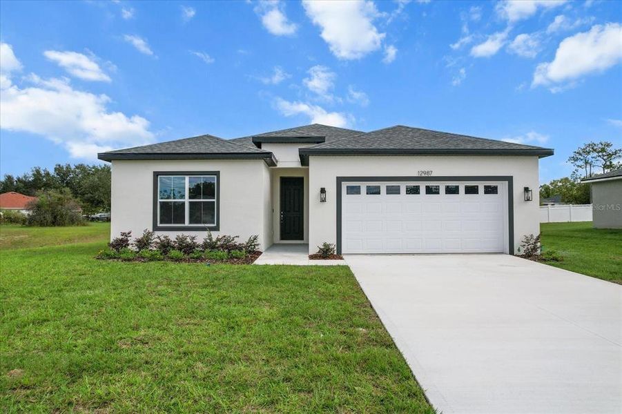 Front exterior of a new home in , Ocala, FL, highlighting curb appeal (Image 25).