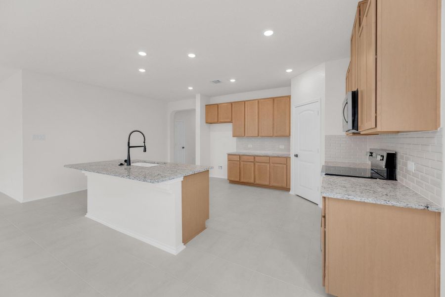 Furnished interior view inside a new home in Mustang Valley, Manor (Image 8).