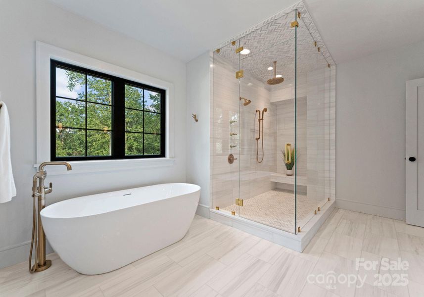 Large soaker tub, Dolomite marble floors & shower and Brizo plumbing fixtures. Large soaker tub, Dolomite marble floors & shower and Brizo plumbing fixtures.