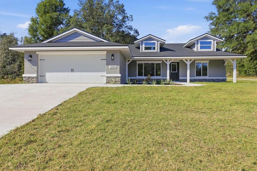 Front exterior of a new home in , Dunnellon, FL, highlighting curb appeal (Image 1).