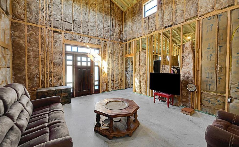 Living room with a towering ceiling Living room with a towering ceiling