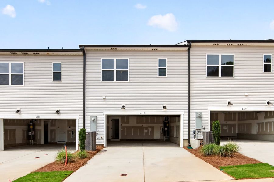 Front exterior of a new home in Amplitude, Charlotte, NC, highlighting curb appeal (Image 2). Front exterior of a new home in Amplitude, Charlotte, NC, highlighting curb appeal (Image 2).