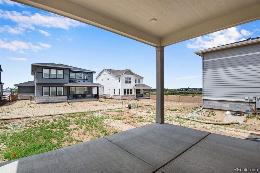Exterior details and patio area of a home in Ensemble at The Aurora Highlands, Aurora (Image 3).