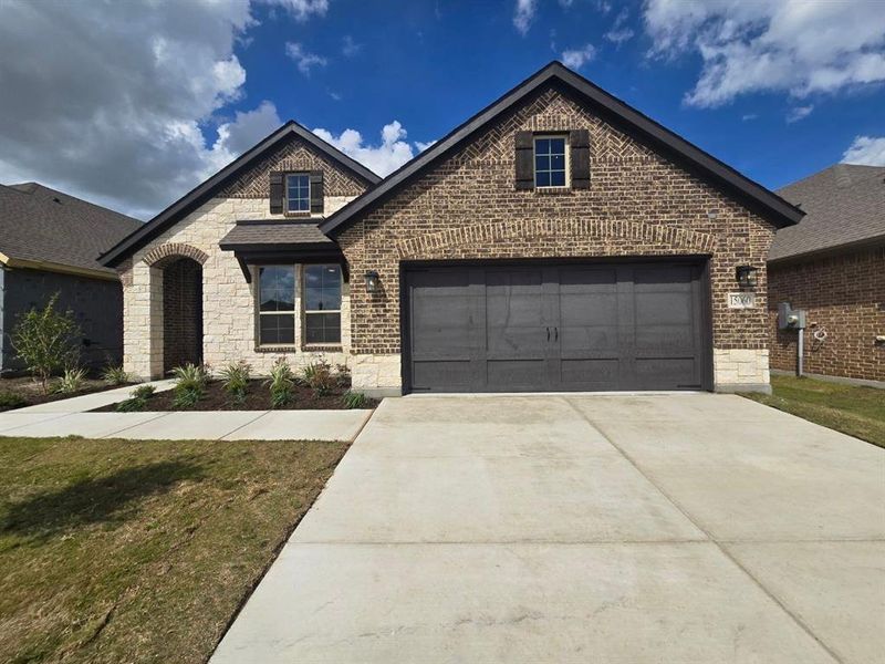 Front exterior of a new home in Morningstar, Aledo, TX, highlighting curb appeal (Image 1). Front exterior of a new home in Morningstar, Aledo, TX, highlighting curb appeal (Image 1).