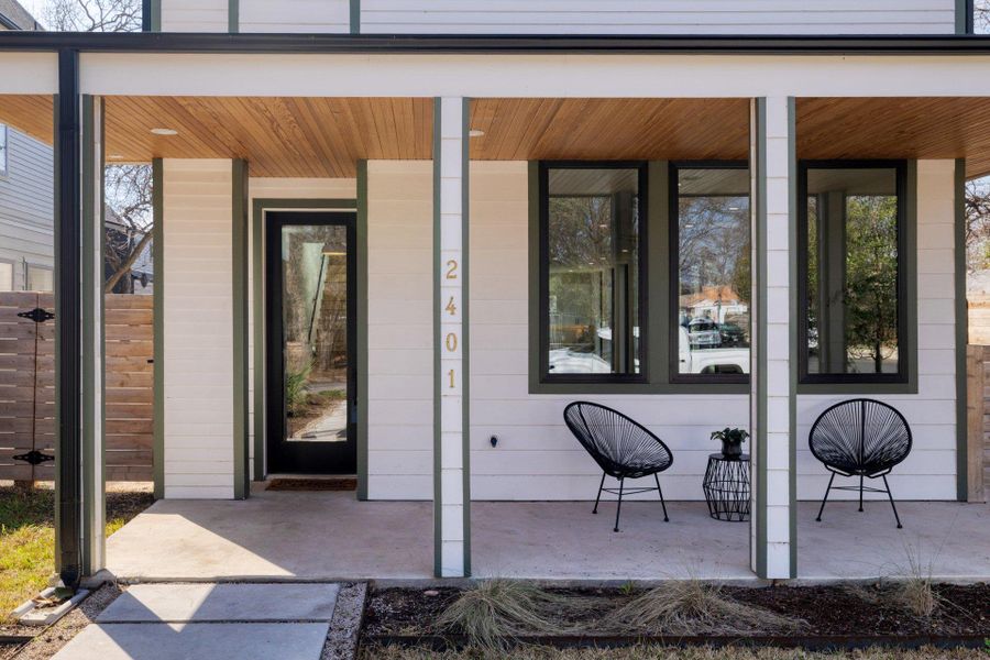 View of exterior entry featuring covered porch