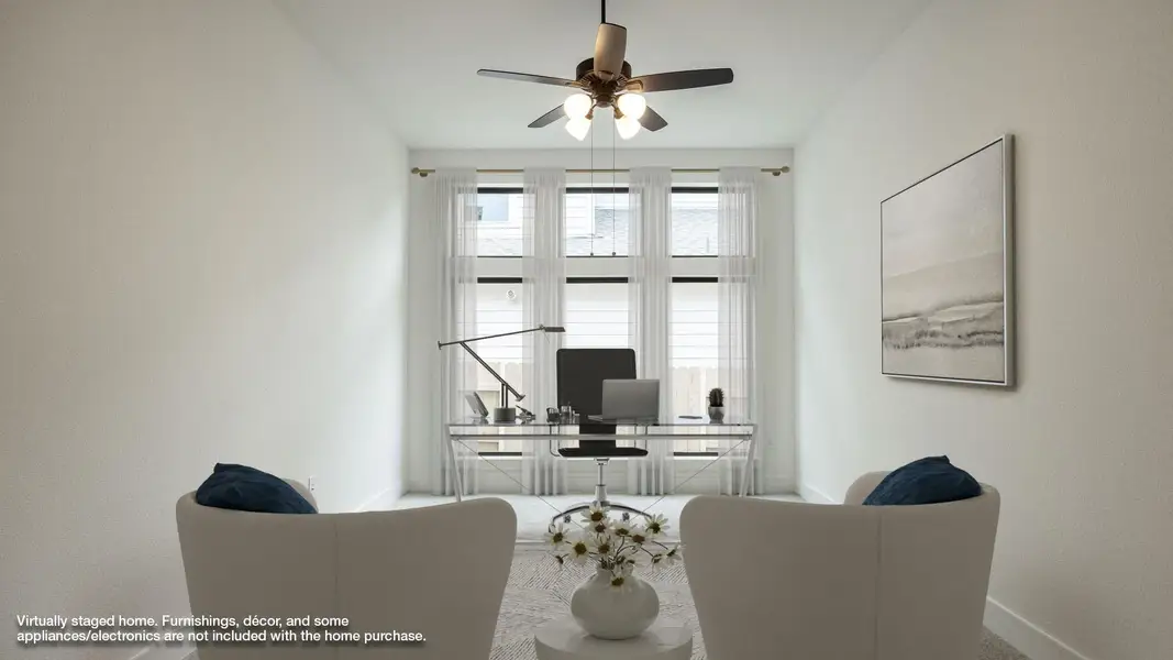 Office area featuring baseboards and a ceiling fan Office area featuring baseboards and a ceiling fan